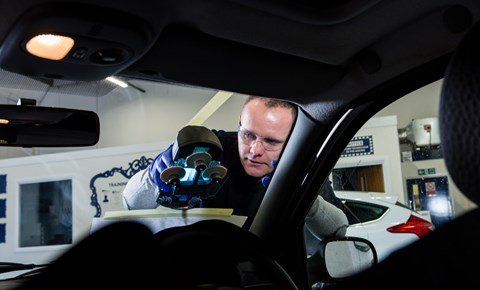 Auto Windscreens technician working on car